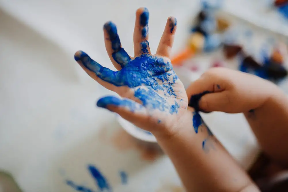 Kids hand painted in blue